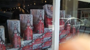 Pyramid of 'That Lady' copies in the window